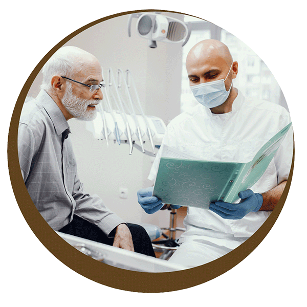 Dentist reviewing records with patient