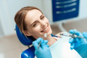 blonde woman in dentist chair