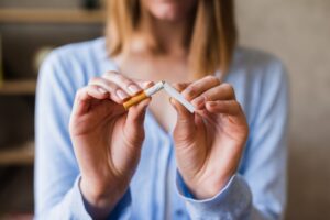 female breaking cigarette