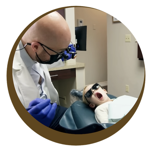 Dr. Wolberg checking a child's teeth
